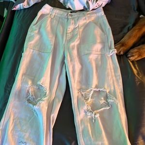 Team color middle rise ripped pants, lightly worn